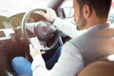 Virtually all use of mobile phones at the wheel will be banned from next year, with guilty motorists facing six points on their licence and a £200 fine.