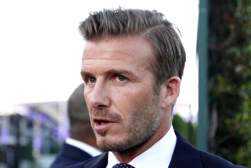 David Beckham is in talks to sell about half of his management business to an American branding company, leaving the former footballer in line for a substantial payout.