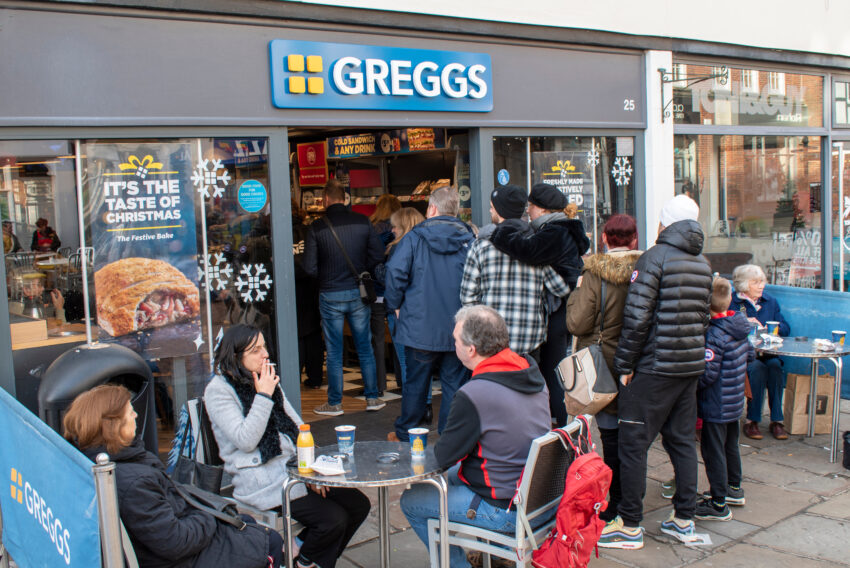 Greggs has warned that inflationary pressures will make its sausage rolls more expensive and curtail profits this year, even as the bakery chain toasted record results.