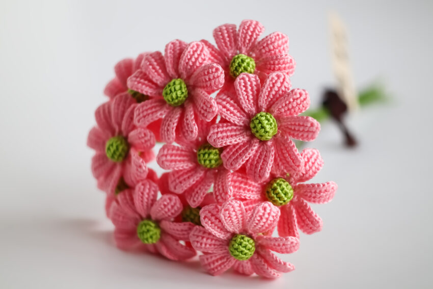 Crocheting flowers is a delightful and rewarding craft that can add a touch of beauty to various projects, from accessories to home decor.